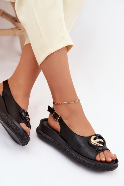 Leather platform sandals with ornaments in black color