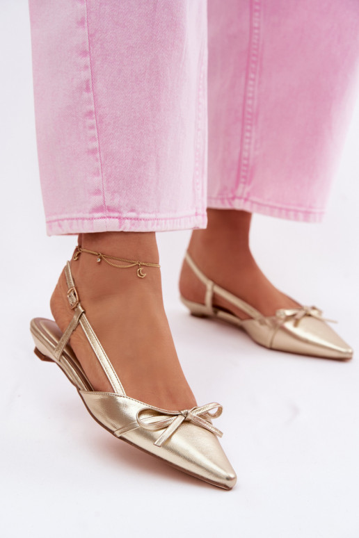 Golden women's sandals made of faux leather on a low heel Jelmera