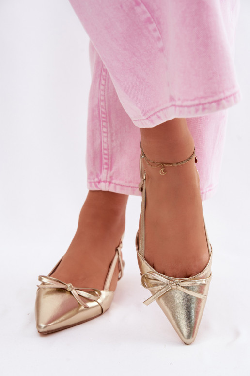 Golden women's sandals made of faux leather on a low heel Jelmera