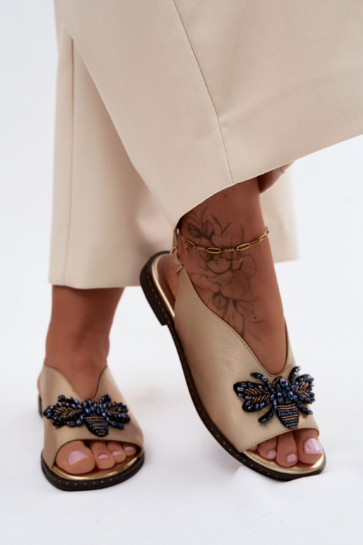 Sandals with shine and ornaments in flat gold Russona