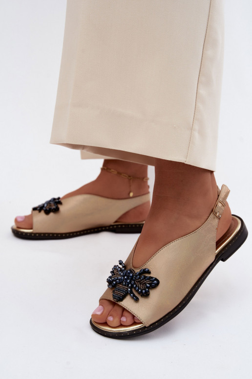 Sandals with shine and ornaments in flat gold Russona