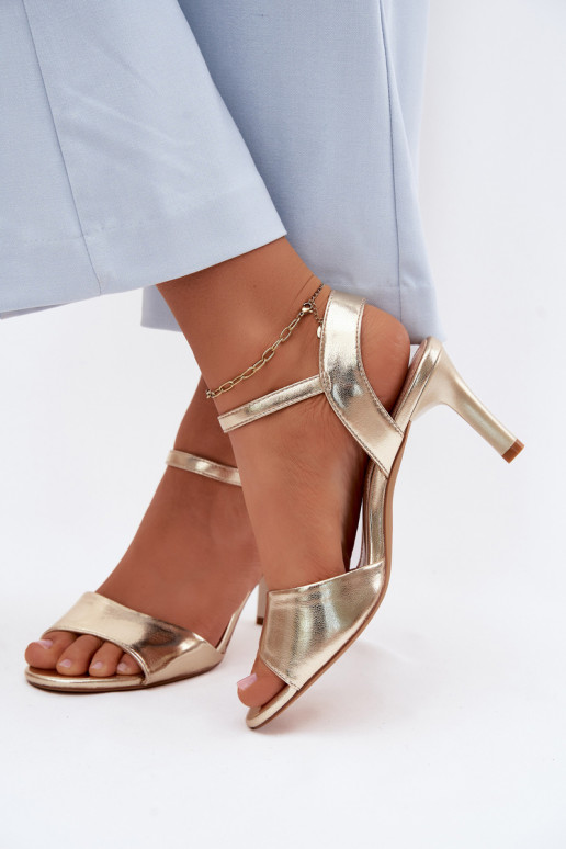 Women's sandals on a thin heel in gold color by Sergio Leone