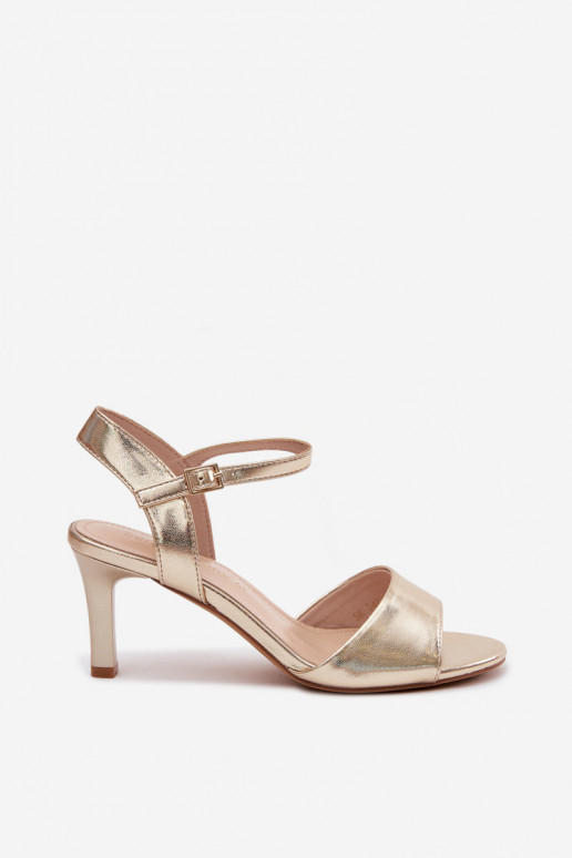 Women's sandals on a thin heel in gold color by Sergio Leone