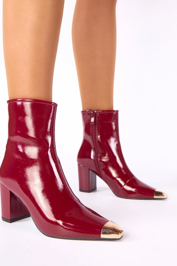 Burgundy patent ankle boots with a golden toe Marilyn