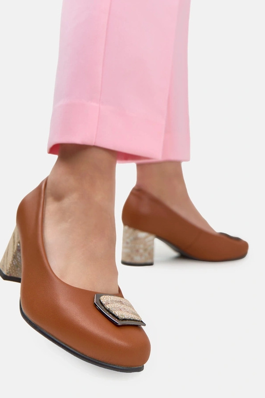 Brown leather pumps on a decorative column Potocki