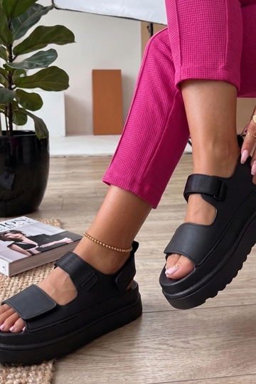 Black sandals with stickers on a high sole Davina