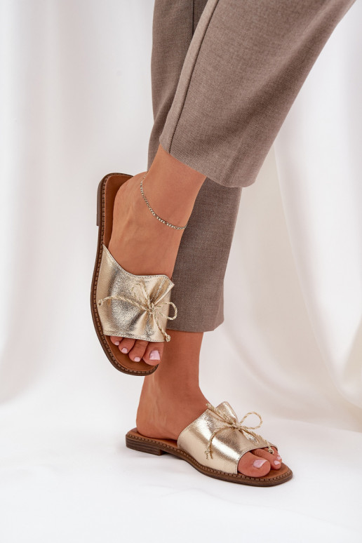 Gold flat slippers with decorative bow Deonelis