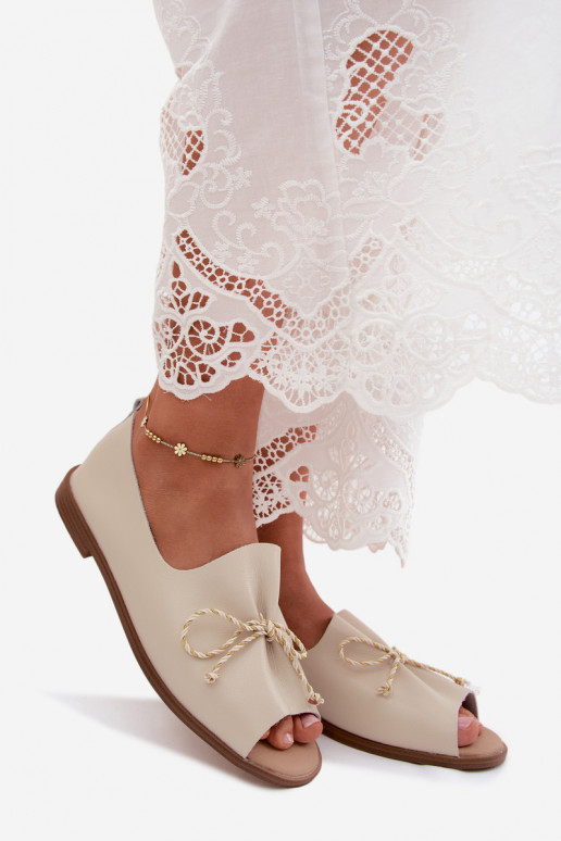 Sand colored women's sandals with decorative laces and shiny finish made of faux leather Coltrania