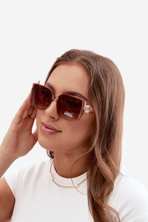 Sunglasses with decorative details in pink color