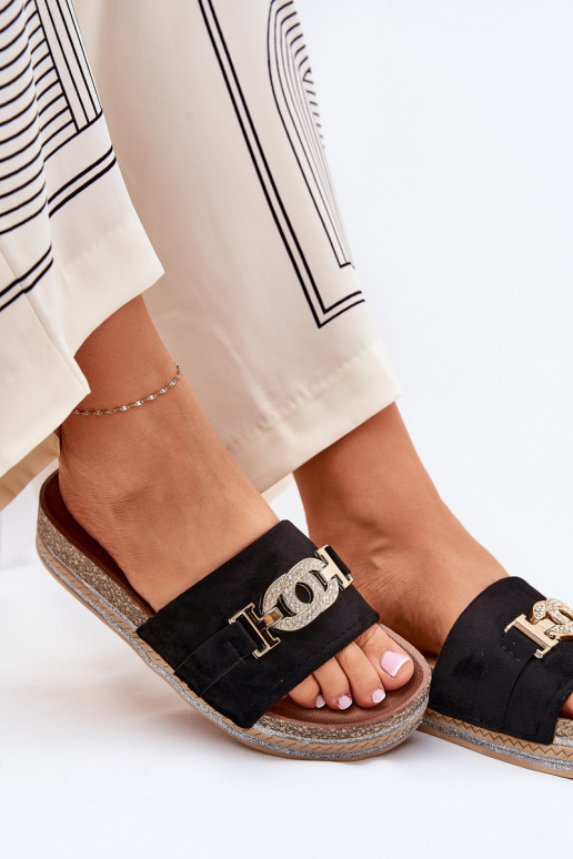 Women's slippers with details on a platform with shine in black Eanes