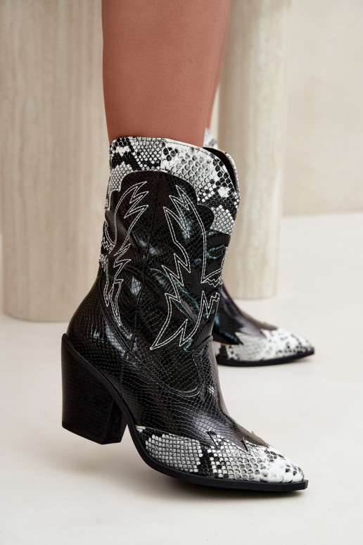 faux fur cowboy-style ankle boots with embossed detail in black and white Ambery