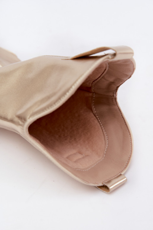 knee-high cowboy-style boots with heels in golden color