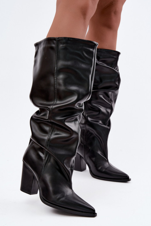 Slip-on knee-high boots with heels and ruffles in faux leather in black Jensy