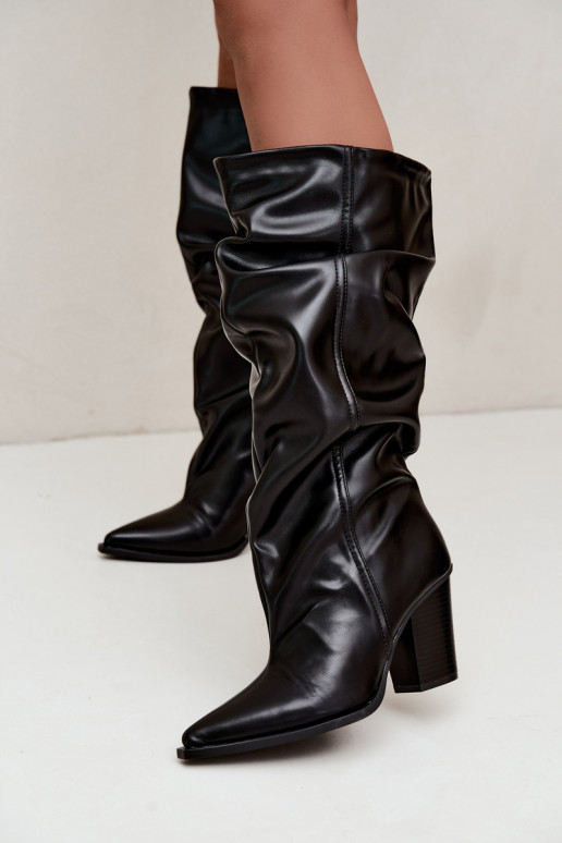 Slip-on knee-high boots with heels and ruffles in faux leather in black Jensy