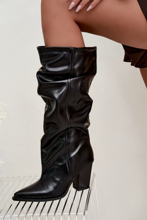 Slip-on knee-high boots with heels and ruffles in faux leather in black Jensy