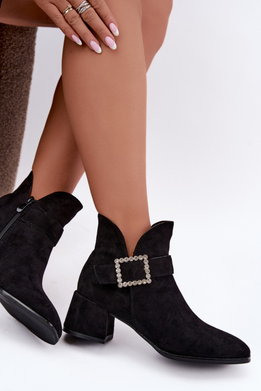 Ankle boots with straps and decorative buckle in black Ameline