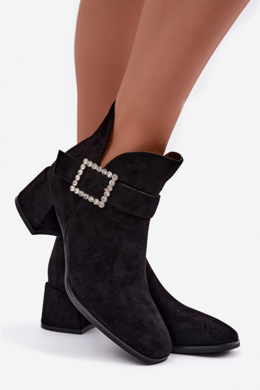 Ankle boots with straps and decorative buckle in black Ameline