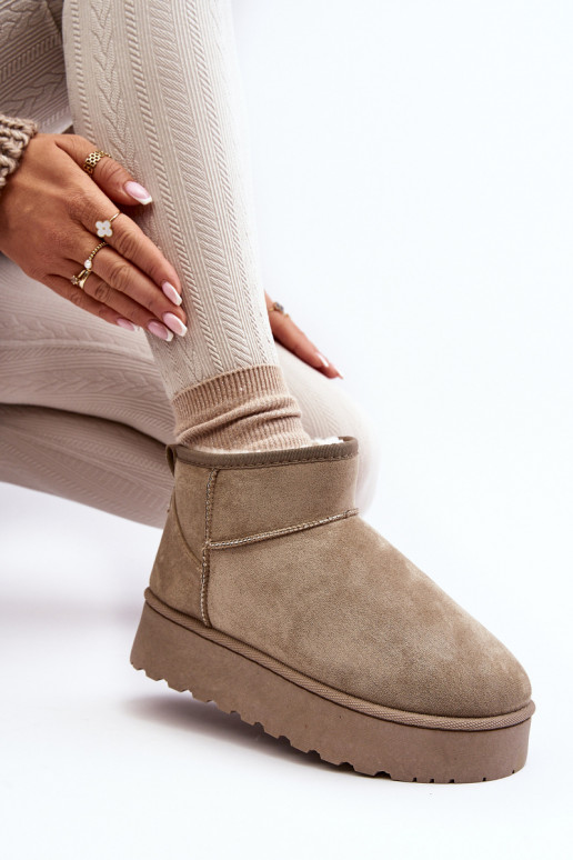 Green women's snow boots on a platform with insulation and fur inside Xamella