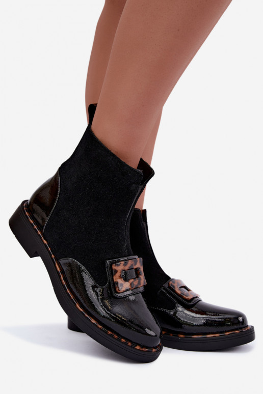 Black suede boots with decorative buckle