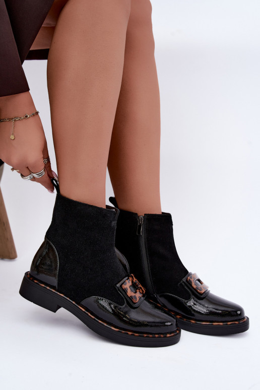 Black suede boots with decorative buckle