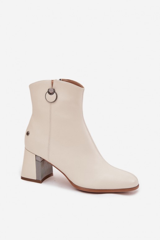 Insulated ankle boots made of natural leather with heels in sand color
