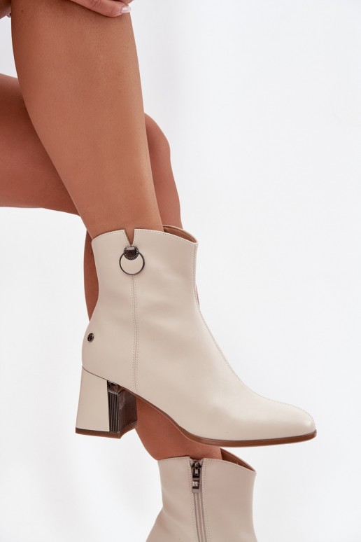 Insulated ankle boots made of natural leather with heels in sand color