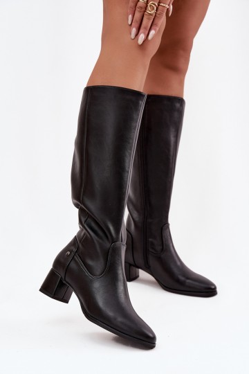 Black insulated women's over-the-knee boots made of leather with heels