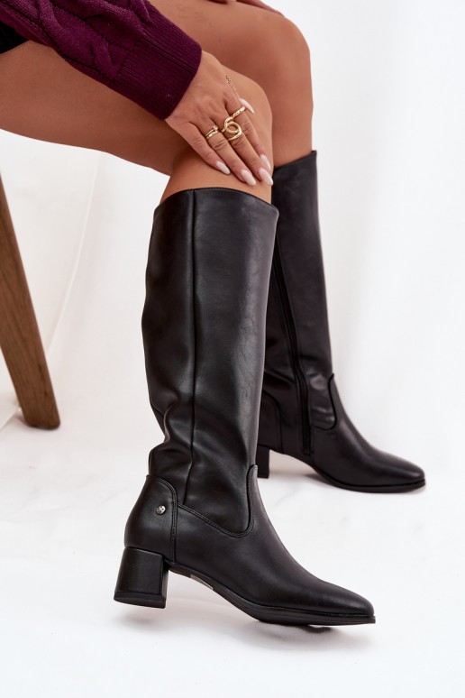 Black insulated women's over-the-knee boots made of leather with heels