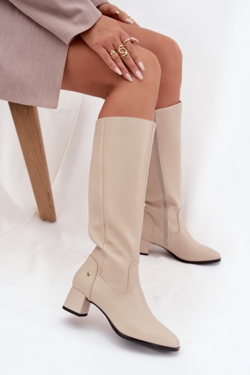 Sand-colored insulated women's over-the-knee boots made of leather with heels