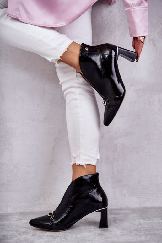 Leather boots on a post  Black Leather boots on a post  Black