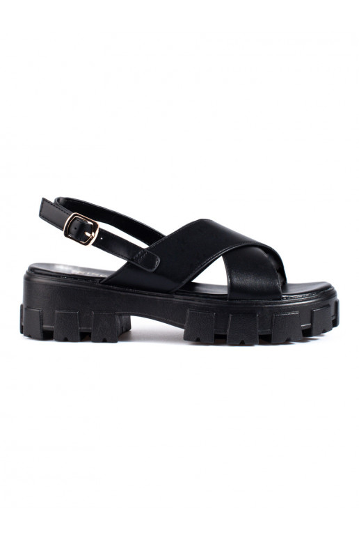 Black sandals on a thick platform... Black sandals on a thick platform...