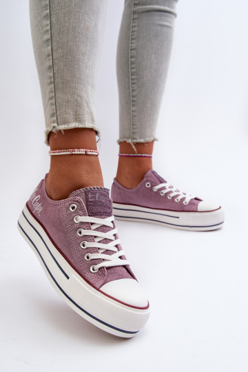 Women's sneakers on a thick...