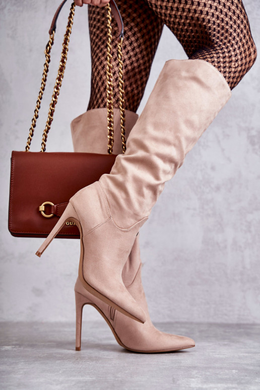 Classic Suede Black Boots On A Beige Ameya