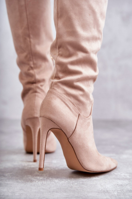 Classic Suede Black Boots On A Beige Ameya